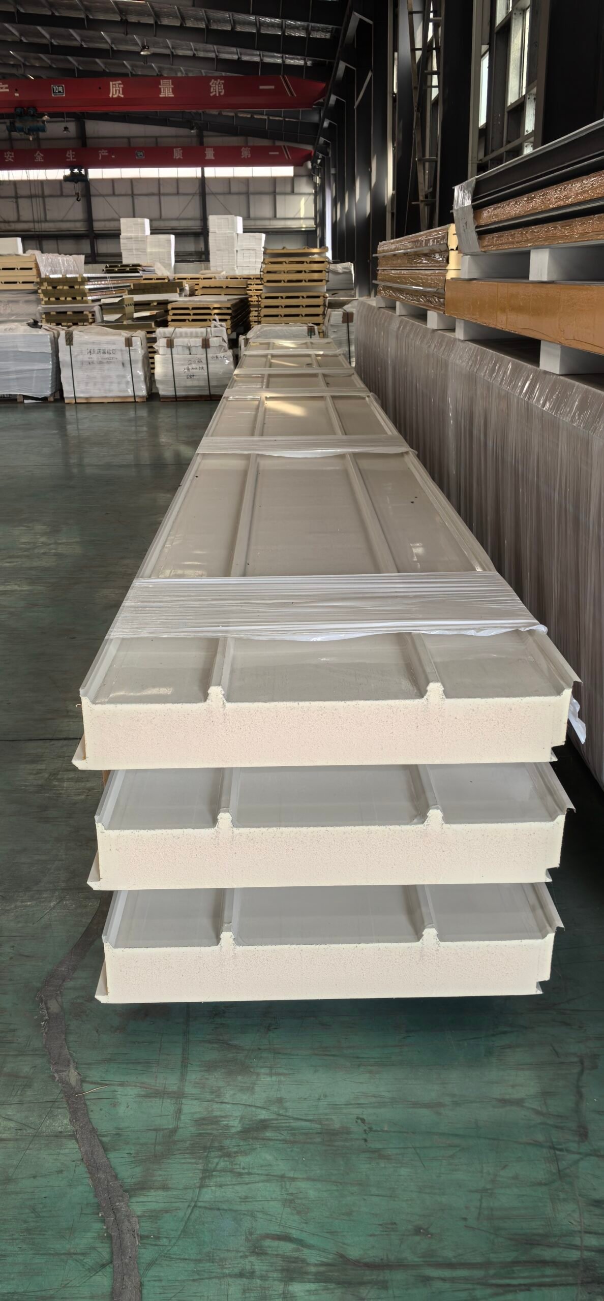 Photovoltaic roof sandwich panels stacked in LIAOHE production facility