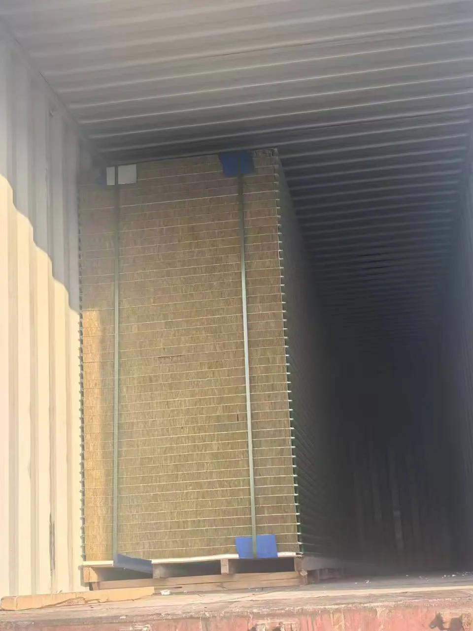 Rock wool roof panels loaded vertically inside 40HQ shipping container