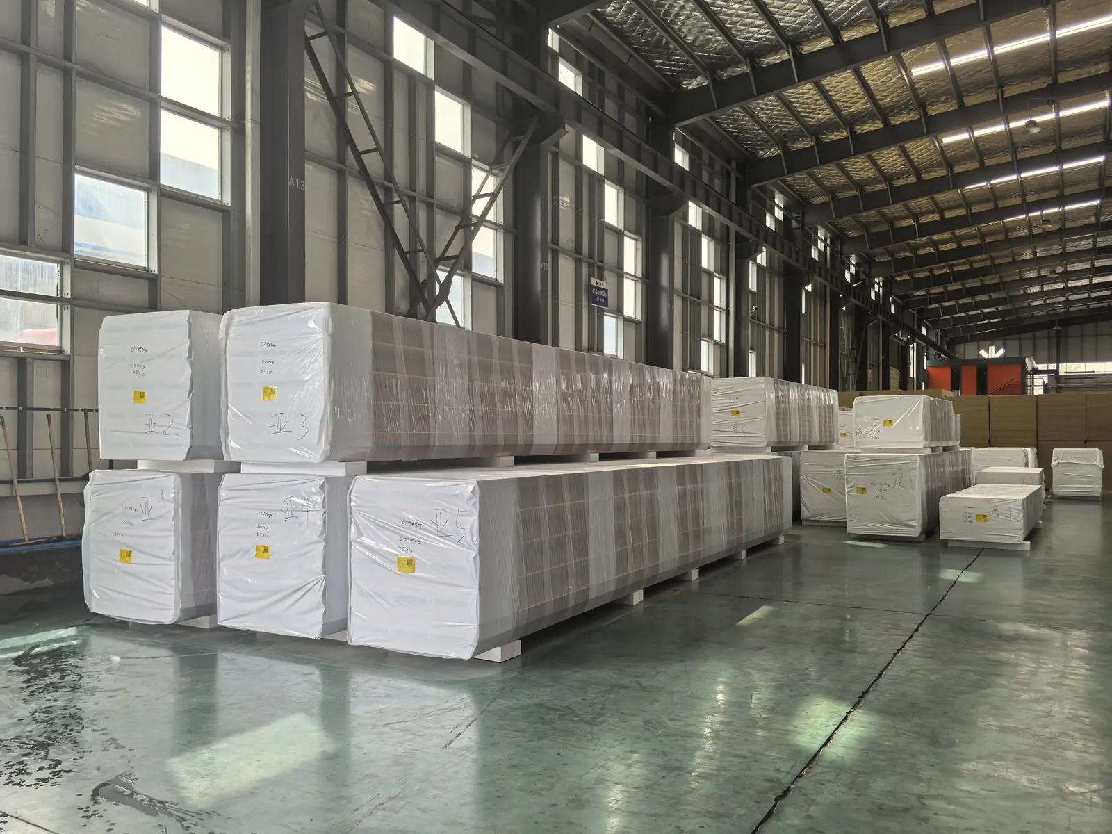 Insulated sandwich panels on Styrofoam pallets with white export protective wrapping